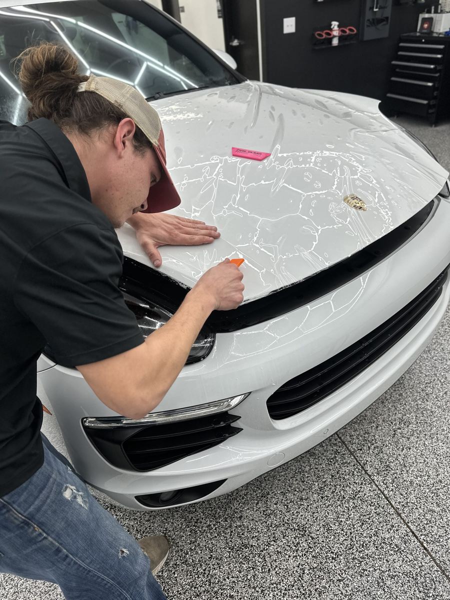 Installing SunTek Ultra PPF on a front bumper at Greenville Detailing